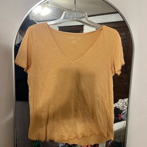 American Eagle light orange tshirt. Only worn 2x in one year